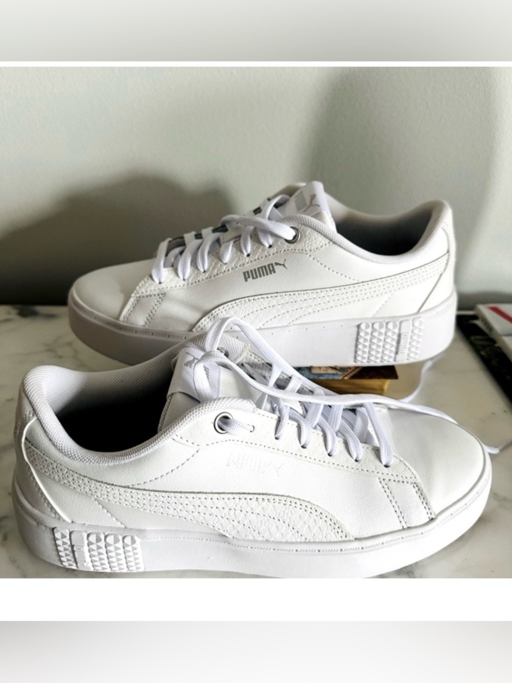 PUMA WOMEN’S SMASH PLATFORM SNEAKER.